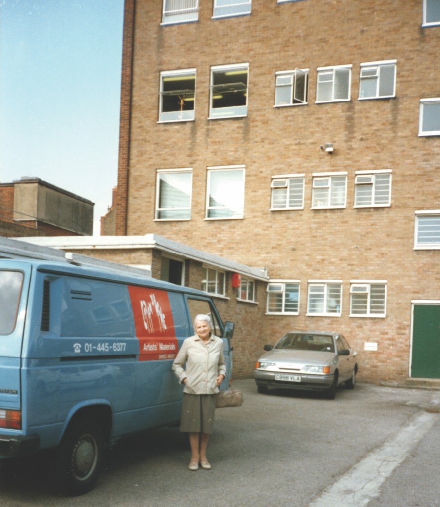 Above: Lydia Sacki and one of the company vans at the old Jakar building in the mid-80